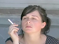 There is no much action on this up skirt video – just a common amateur brunette smoking her cigarette and paying no attention on panty sitting upskirt seen.